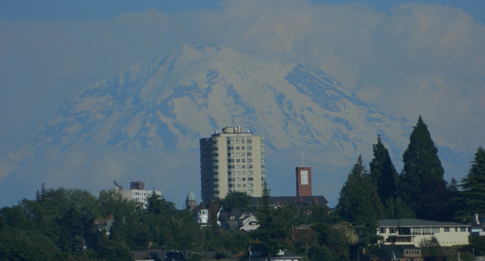 Mt. Rainier from Ruston Way in the summer. The hospital in the Hilltop neighborhood is often a photo subject in Tacoma. (Photo by Craig Craker)