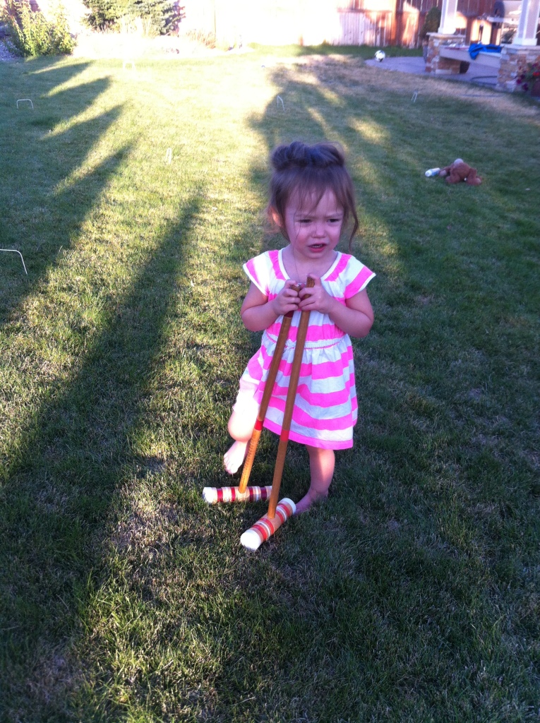 Catarina getting in some early practice on the croquet course.